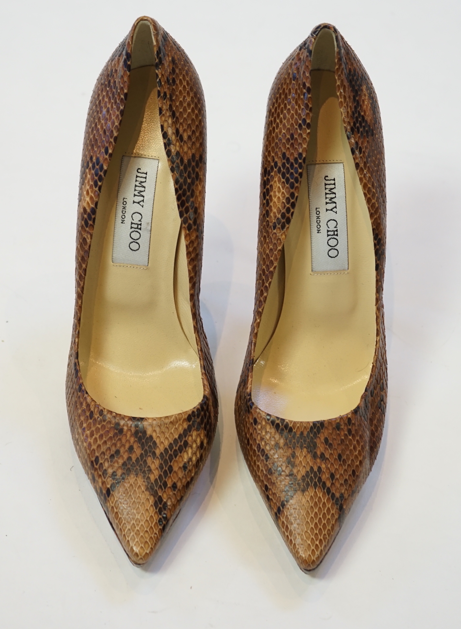 A pair of Jimmy Choo lady's snakeskin platform pumps in brown and black